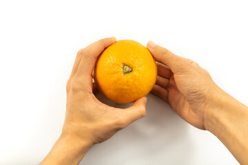 Orange in man's hand son white isolated background