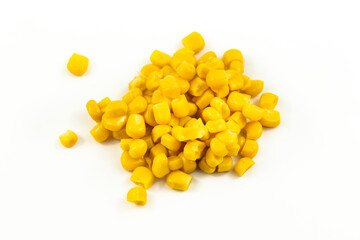 Handful of canned corn on white isolated background