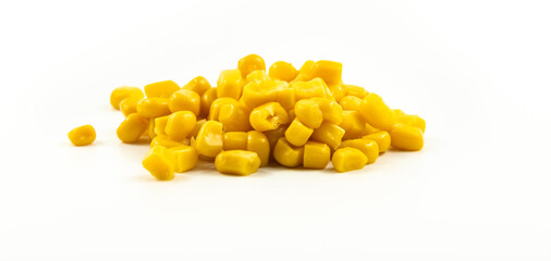 Handful of canned corn on white isolated background banner