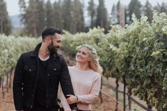 Loving Couple Looking at Each Other in Vineyard