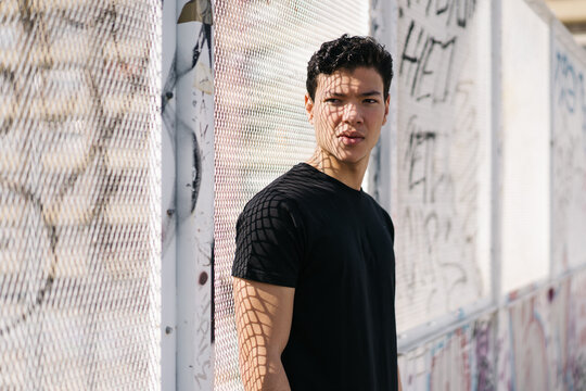 Portrait of ethnic sportsman looking at camera