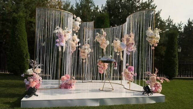 Wooden wedding hall is decorated with wedding decor. Beautiful wedding