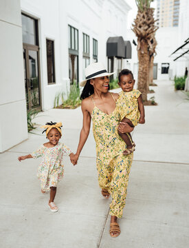 Mom and daughter wearing matching floral dresses