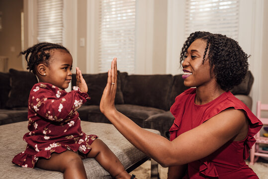 Mom Giving daughter high five