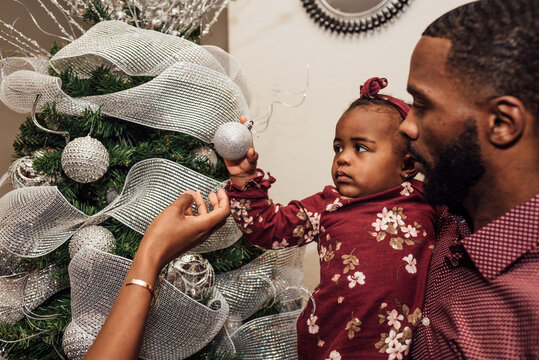Family Decorating Christmas Tree