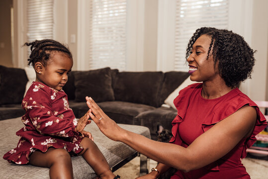 Mom Giving daughter high five