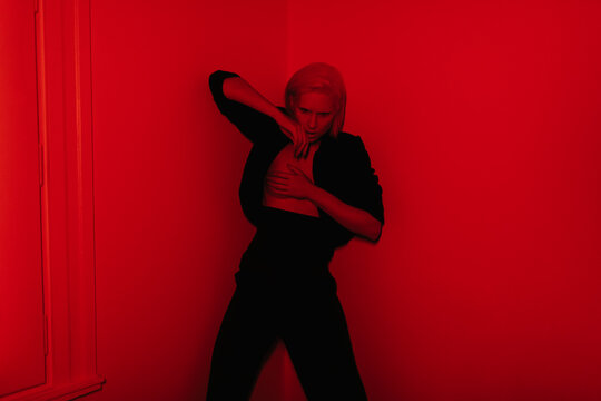 Seductive lady under red light