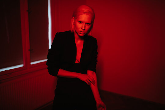 Seductive lady under red light