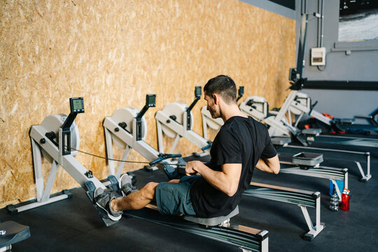 Sportman exercising on machines