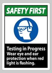 Safety First Sign Testing In Progress, Wear Eye And Ear Protection When Red Light Is Flashing