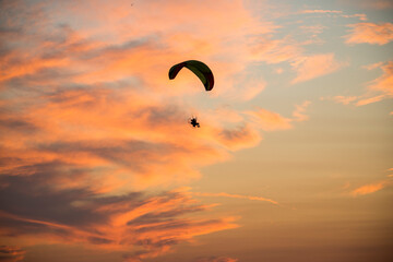 paraglider silhouette at sunset