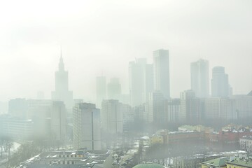 Characteristic view of a modern city skyline covered in a dense smog and pollution
