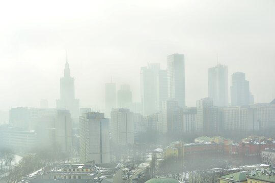 Characteristic view of a modern city skyline covered in a dense smog and pollution
