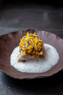 Seabass with citrics and flowers