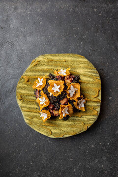 Braised octopus with quinoa and flowers