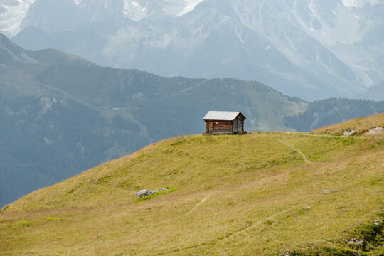 A small alpine wooden cabin on a hill in La Chaux Verbier, Switzerland