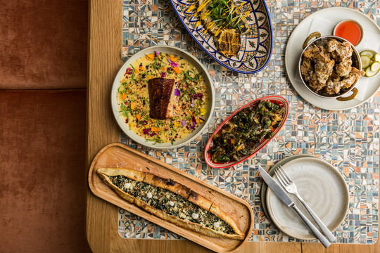 Abundant scene of middle eastern food in a restaurant.