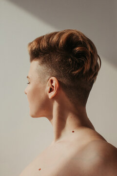 Androgynous woman with short hair looking away