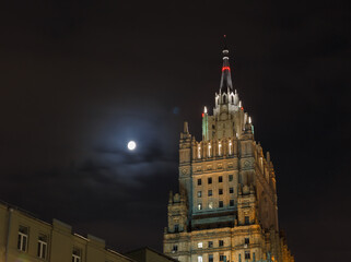 Fototapeta na wymiar Moscow, Russia, Oct 28, 2020: .The Ministry of Foreign Affairs of the Russian Federation building in night. Moon shining nearby.