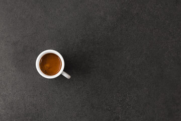 Espresso shot on dark table. Speciality coffee concept.