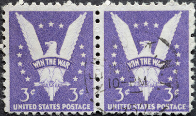 USA - Circa 1942: a double postage stamp printed in the US showing the picturing the American eagle. Text: Win the War