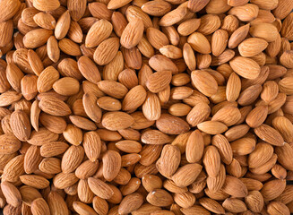 Background of almonds closeup. The nuts