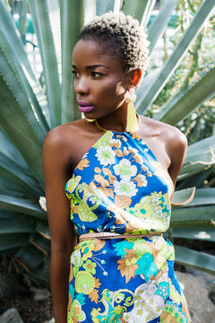 Beautiful African woman wearing color dress and bijou