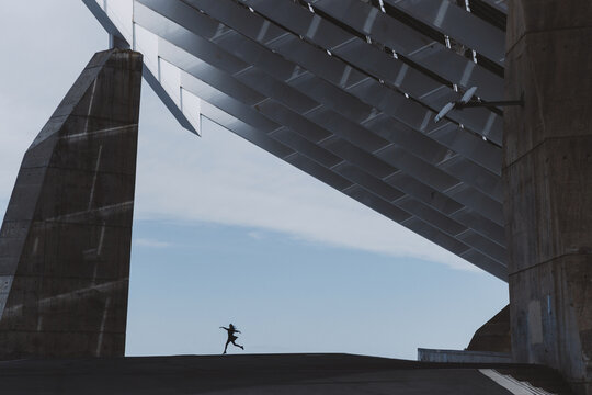 Dancer dancing on roof of beautiful build.