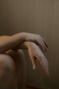 beautiful hands of a girl on a neutral background