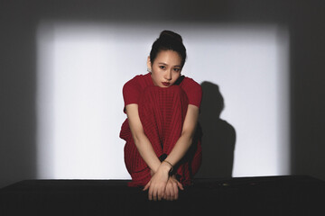 A Chinese beauty in a red skirt