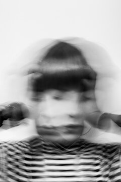 emotional pressure, headache, portrait of stressed woman, motion blur