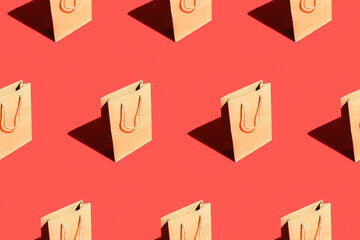 Seamless pattern from craft bags on a red background.
