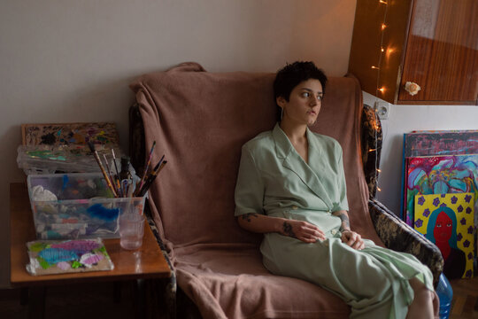 girl sitting on an armchair