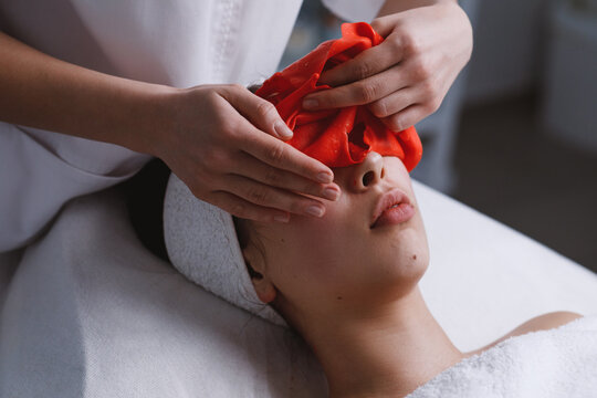 Doctor finishing facial skin treatment.