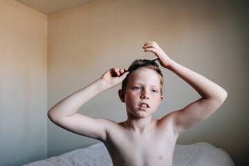 Boy Styling Hair at Home