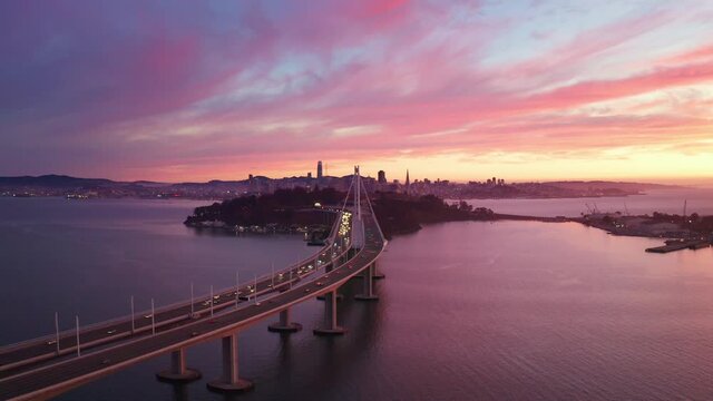 San Francisco Oakland Bay Bridge Aerial Cityscape Flythrough with Colorful Sunset