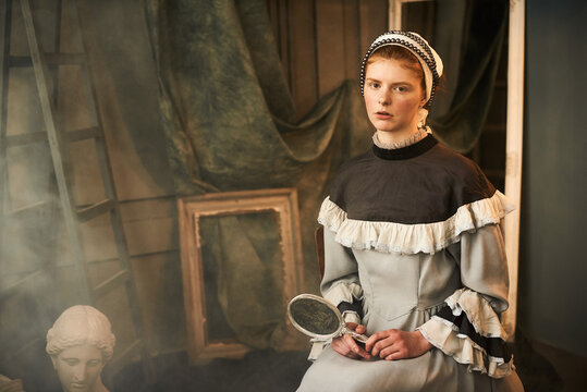 A portrait of red haired woman in old dress