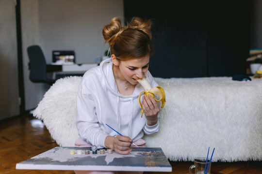 Girl eating while working