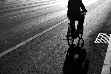 A figure on an old bicycle