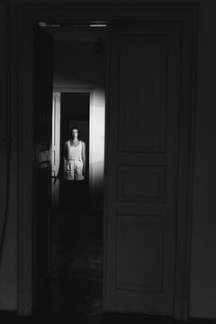 A girl inside the dark room