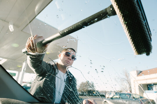 Man Washing Car Window
