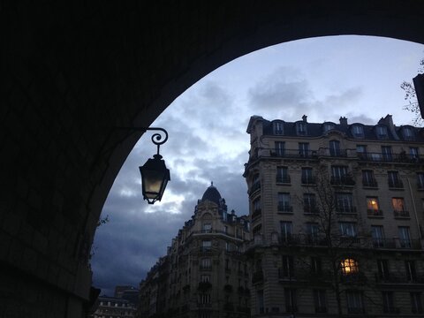 night in Paris, street lights and traditional architecture, France