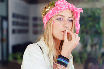 Young caucasian woman standing outdoor with cigarette - Beautiful girl smoking joint in summer day...