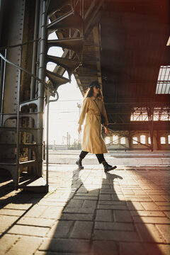Elegant young woman scrolling on station