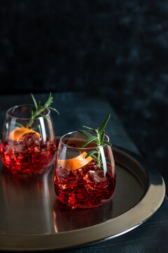 Classic Negroni cocktail with smoked rosemary garnish