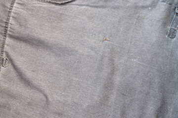 The texture of the fabric is olive-colored, which is similar to the fisherman or hunters waistcoat
