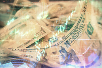 Double exposure of forex graph drawing over us dollars bill background. Concept of financial markets.