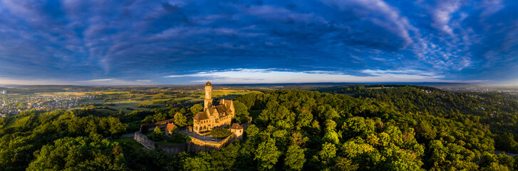 Germany, Bavaria, Bamberg, Helicopter panorama of Altenburg castle at summer dusk