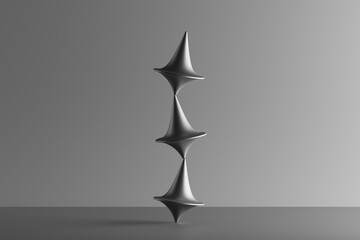Three dimensional render of three metallic spinning tops balancing on top of each other
