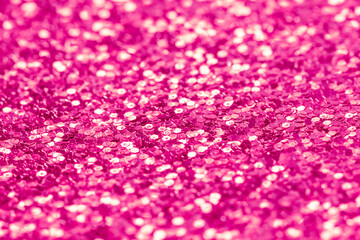 Abstract festive pink background. Blurred glitter texture.